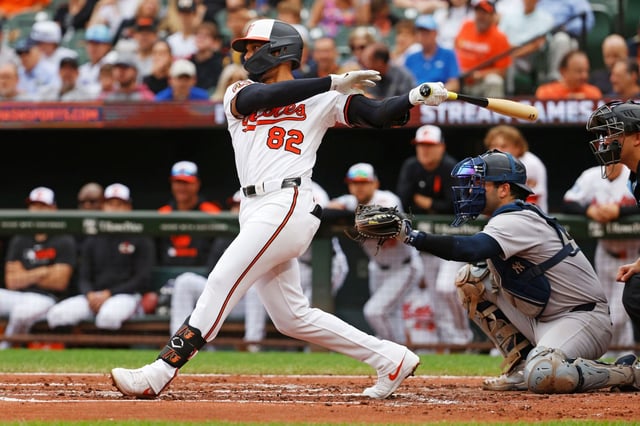 Baltimore Orioles second base Jeremiah Jackson (82) hits a double during the second inning of a baseball game against the New York Yankees, Sunday, Sept. 21, 2025, in Baltimore. (AP Photo/Peter Casey)