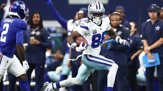 Sep 14, 2025; Arlington, Texas, USA; Dallas Cowboys wide receiver CeeDee Lamb (88) runs with the ball against the New York Giants during the second quarter at AT&T Stadium. Mandatory Credit: Kevin Jairaj-Imagn Images