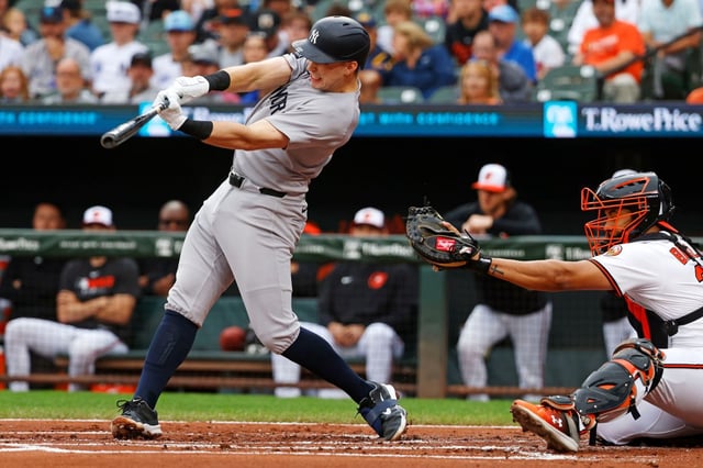 New York Yankees Ben Rice (22) hits a single during the second inning of a baseball game against the Baltimore Orioles, Sunday, Sept. 21, 2025, in Baltimore. (AP Photo/Peter Casey)