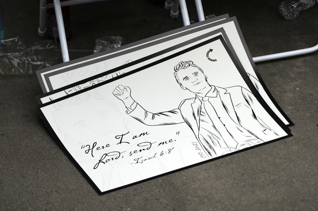 A poster depicting conservative activist Charlie Kirk is pictured at Kirk's memorial, Sunday, Sept. 21, 2025, at State Farm Stadium in Glendale, Ariz.
