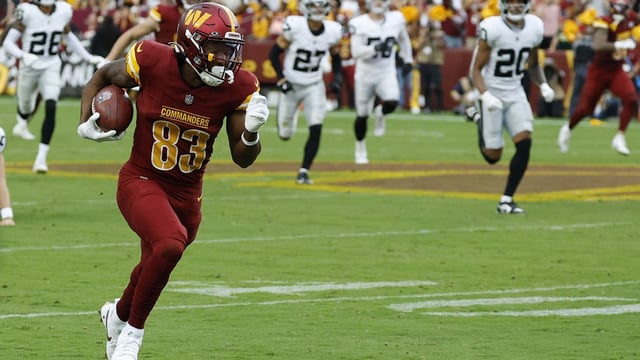 Sep 21, 2025; Landover, Maryland, USA; Washington Commanders wide receiver Jaylin Lane (83) returns a punt for a touchdown against the Las Vegas Raiders during the third quarter at Northwest Stadium. Mandatory Credit: Geoff Burke-Imagn Images