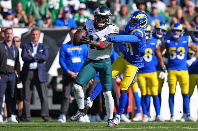 AJ. Brown #11 of the Philadelphia Eagles catches a pass in front of Darious Williams of the Los Angeles Rams on September 21, 2025 in Philadelphia.
