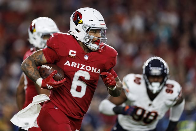 GLENDALE, ARIZONA - NOVEMBER 3: Running back James Conner #6 of the Arizona Cardinals carries the ball during the third quarter of an NFL game against the Chicago Bears at State Farm Stadium on November 3, 2024 in Glendale, Arizona. Connor has signed a new contract extension.