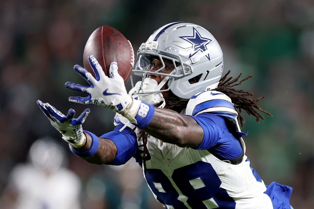 CeeDee Lamb of the Dallas Cowboys reacts after making a reception in the second quarter of the game against the New York Giants at AT&T Stadium on September 14, 2025 in Arlington, Texas.