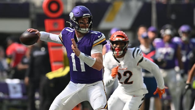 Sep 21, 2025; Minneapolis, Minnesota, USA; Minnesota Vikings quarterback Carson Wentz (11) throws downfield against the Cincinnati Bengals during the first half at U.S. Bank Stadium. Mandatory Credit: Jeffrey Becker-Imagn Images