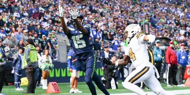 Seattle Seahawks wide receiver Tory Horton (15) catches the ball for a touchdown during the second quarter against the New Orleans Saints at Lumen Field. Mandatory Credit: Steven Bisig-Imagn Images