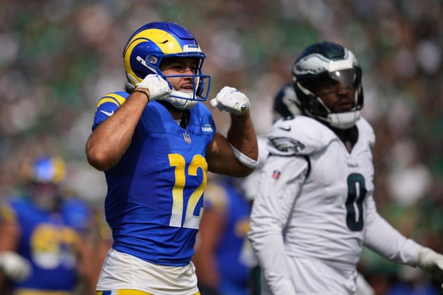 Rams wide receiver Puka Nacua (12) celebrates after making a catch for a first down during the first half of an NFL football game against the Philadelphia Eagles Sunday, Sept. 21, 2025, in Philadelphia. (AP Photo/Matt Slocum)