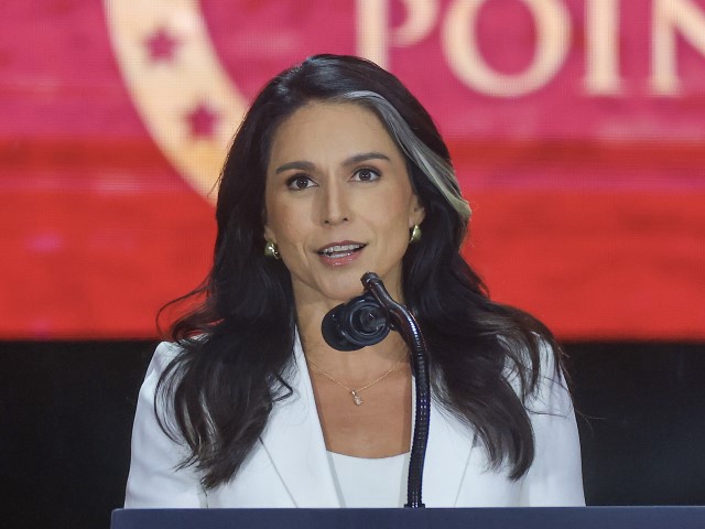 Director of National Intelligence Tulsi Gabbard speaks during the memorial service for political activist Charlie Kirk at State Farm Stadium on September 21, 2025 in Glendale, Arizona. Kirk, the CEO and co-founder of Turning Point USA, was shot and killed on September 10th while speaking at an event during his "American Comeback Tour" at Utah Valley University. (Photo by Joe Raedle/Getty Images)