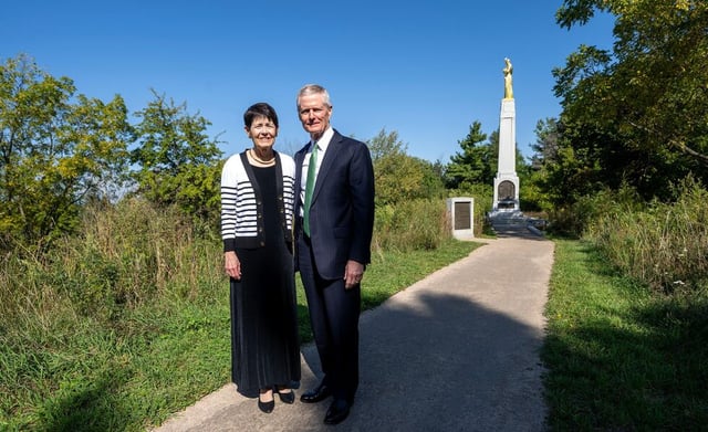 Elder David A. Bednar of the Quorum of the Twelve Apostles and his wife, Sister Susan Bednar pose for a photo at the Hill Cumorah Historic Site while visiting Church history sites in Palmyra, New York, on Thursday, Sept. 18, 2025.