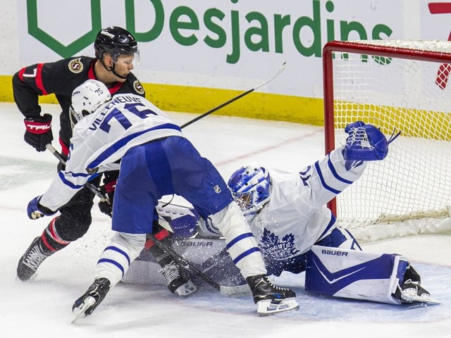 Ottawa Senators captain Brady Tkachuk is denied as Toronto Maple Leaf William Villeneuve goes tumbling over his goalie, Artur Akhtyamov, during the preseason opener at the Canadian Tire Centre on Sunday, Sept. 21, 2025.