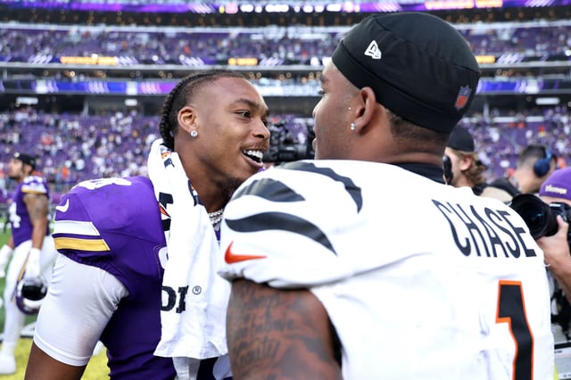 Justin Jefferson #18 of the Minnesota Vikings and Ja'Marr Chase #1 of the Cincinnati Bengals talk after the game at U.S. Bank Stadium on September 21, 2025 in Minneapolis, Minnesota.