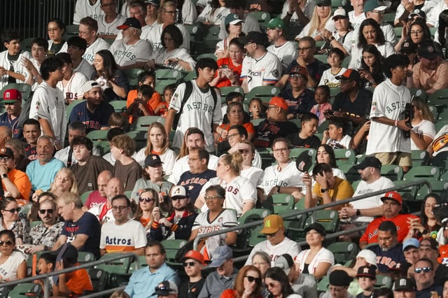 Fans are seen during the first inning of a MLB baseball game in Houston, Sunday, Sept. 21, 2025.