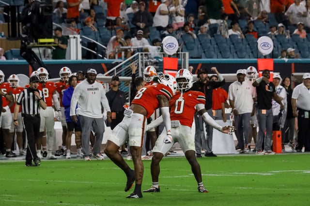Makena Wong, Photo Editor, Fifth-year senior defensive back Jakobe Thomas (8) and sixth-year redshirt senior defensive back Keionte Scott (0) celebrate after tackling University of Florida player in second quarter on Saturday, Sep. 20, 2025.
