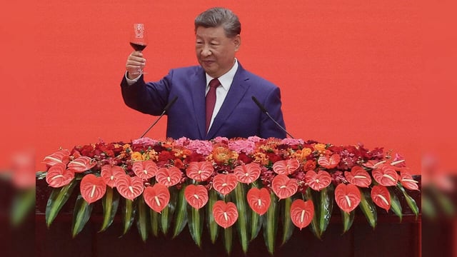 Chinese President Xi Jinping toasts on a reception following a military parade t...
