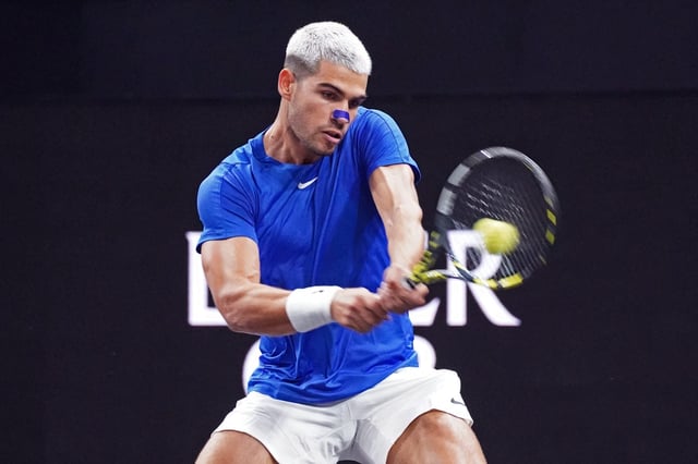 Sep 21, 2025; San Francisco, CA, USA;  Team Europe player Carlos Alcaraz returns a shot from Team World player Francisco Cerundolo during the Laver Cup at Chase Center. Mandatory Credit: David Gonzales-Imagn Images