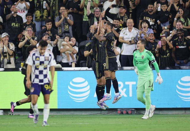 LOS ANGELES, CALIFORNIA – SEPTEMBER 21: Denis Bouanga #99 of LAFC congratulates Son Heung-Min #7 after he scored a goal against Real Salt Lake during the first half of the game  at BMO Stadium on September 21, 2025 in Los Angeles, California. (Photo by Kevork Djansezian/Getty Images)