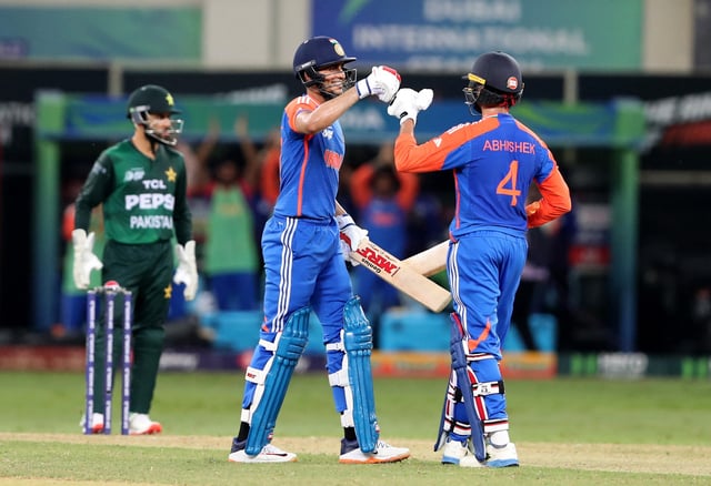 Cricket - Asia Cup - Group A - India v Pakistan - Dubai International Cricket Stadium, Dubai, United Arab Emirates - September 21, 2025 India's Shubman Gill and Abhishek Sharma REUTERS/Satish Kumar