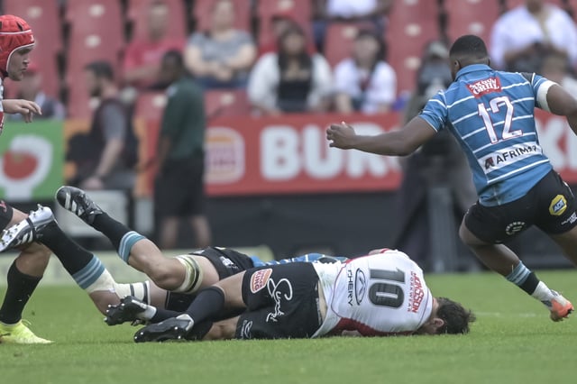 JOHANNESBURG, SOUTH AFRICA - SEPTEMBER 20:  Chris Smit of the Fidelity ADT Lions is injured as Gustav Erlank of Griquas tackles him during the Carling Currie Cup final match between Fidelity ADT Lions and Suzuki Griquas at Ellis Park on September 20, 2025 in Johannesburg, South Africa. (Photo by Christiaan Kotze/Gallo Images)