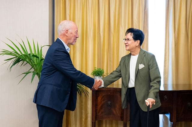 In this file photo, taken Sept. 13, 2025, and provided by CJ Group, the group's Chairman Lee Jay-hyun (R) shakes hands with Michael Payne, chairman and CEO of Payne Sports Media Strategies, in an unidentified location in London during Lee's first on-site management activities in Europe. (PHOTO NOT FOR SALE) (Yonhap)