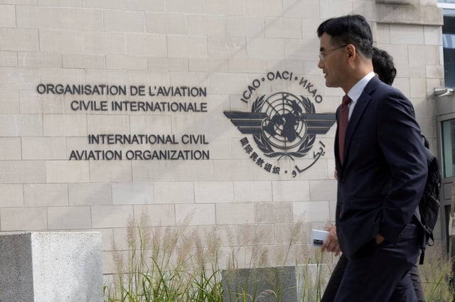 Members of the International Civil Aviation Organization (ICAO) agency arrive at ICAO headquarters in Montreal, Quebec, Canada October 1, 2022.  REUTERS/Christinne Muschi/File Photo