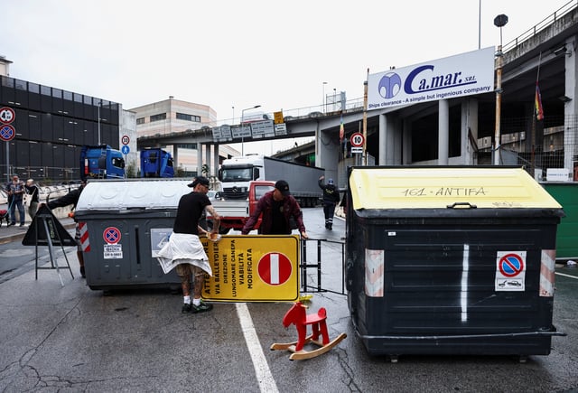 Dockworkers take part in a strike near the port of Genoa as part of a nationwide "Let's Block Everything" protest, with activists calling for a halt to arms shipments to Israel, in Genoa, Italy, September 22, 2025. REUTERS/Matteo Minnella