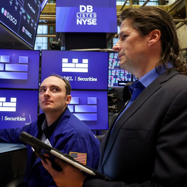 Traders work on the floor at the New York Stock Exchange (NYSE) in New York City, U.S., September 15, 2025.  REUTERS/Brendan McDermid/ File Photo