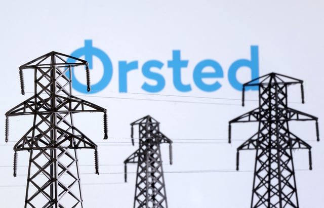 Electric power transmission pylon miniatures and Orsted logo are seen in this illustration taken, December 9, 2022. REUTERS/Dado Ruvic/Illustration/File Photo