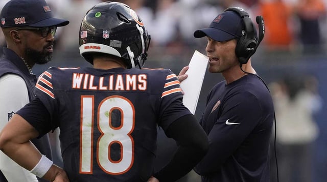 Sep 21, 2025; Chicago, Illinois, USA; Chicago Bears head coach Ben Johnson talks with quarterback Caleb Williams (18) against the Dallas Cowboys during the second half at Soldier Field. Mandatory Credit: David Banks-Imagn Images
