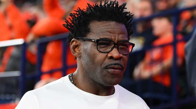 Hall of Fame member Michael Irvin looks on during the first half of a game between the Miami Hurricanes and the Syracuse Orange at the JMA Wireless Dome