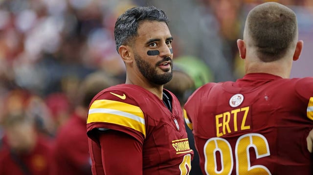 Sep 21, 2025; Landover, Maryland, USA; Washington Commanders quarterback Marcus Mariota (8) and Washington Commanders tight end Zach Ertz (86) react from the sidelines during the second half against the Las Vegas Raiders at Northwest Stadium. Mandatory Credit: Amber Searls-Imagn Images