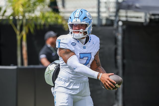 Sep 20, 2025; Orlando, Florida, USA; North Carolina Tar Heels quarterback Gio Lopez (7) warms up before the game against the UCF Knights at the Bounce House Stadium. Mandatory Credit: Mike Watters-Imagn Images