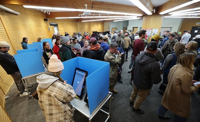 Voters stand in an hourlong line at Hogle Zoo in Salt Lake City on Tuesday, Nov. 5, 2024.