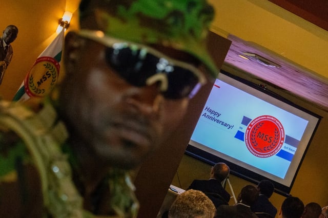 A Kenyan police officer looks on during an event marking the one year anniversary of the arrival of an international security force in Haiti June 26, 2025