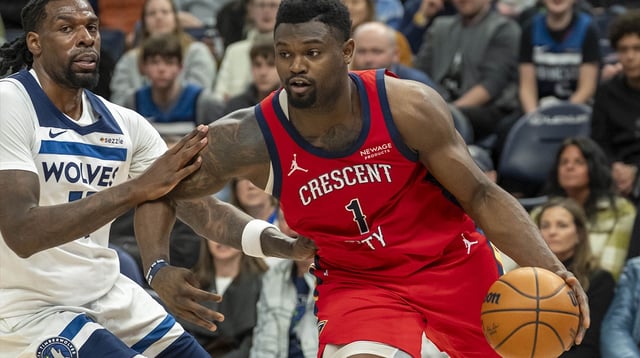 Mar 19, 2025; Minneapolis, Minnesota, USA; New Orleans Pelicans forward Zion Williamson (1) drives to the basket past Minnesota Timberwolves center Naz Reid (11) in the second half at Target Center. Mandatory Credit: Jesse Johnson-Imagn Images