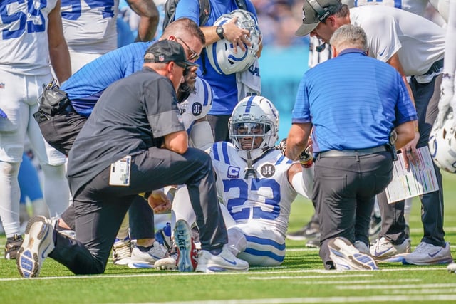 Sep 21, 2025; Nashville, Tennessee, USA; Indianapolis Colts cornerback Kenny Moore II (23) is helped up during the fourth quarter against the Tennessee Titans at Nissan Stadium. Mandatory Credit: Andrew Nelles-USA TODAY Network via Imagn Images