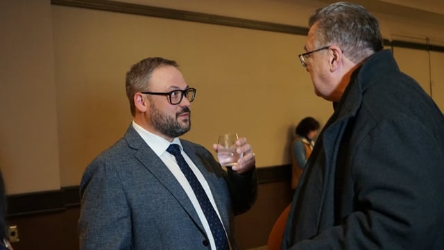 Chris Scott, left, speaks with a supporter following the Ontario election in February. Scott is no longer a member of the Progressive Conservative caucus. Sault Ste. Marie police have announced he was arrested in Toronto.