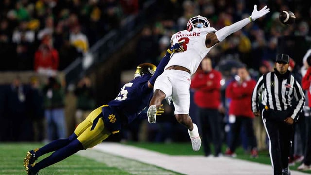 Notre Dame cornerback Leonard Moore (15) interrupts a reception attempt by Indiana wide receiver Omar Cooper Jr. (3) during the first round of the College Football Playoff between Notre Dame and Indiana on Friday, Dec. 20, 2024, in South Bend. MICHAEL CLUBB/SOUTH BEND TRIBUNE / USA TODAY NETWORK via Imagn Images