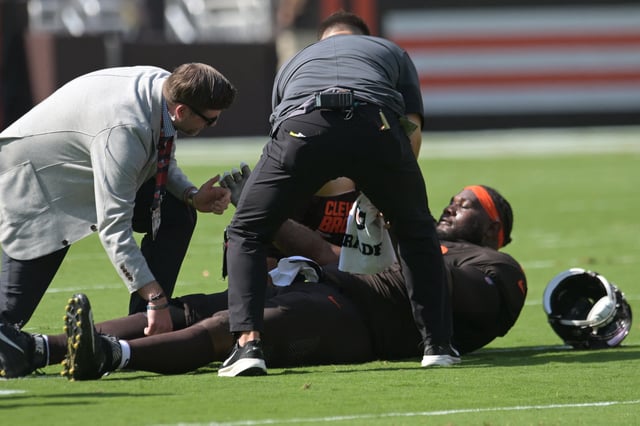 Sep 21, 2025; Cleveland, Ohio, USA; Cleveland Browns offensive tackle Dawand Jones (79) lies on the field after being injured against the Green Bay Packers during the first quarter at Huntington Bank Field. Mandatory Credit: Ken Blaze-Imagn Images
