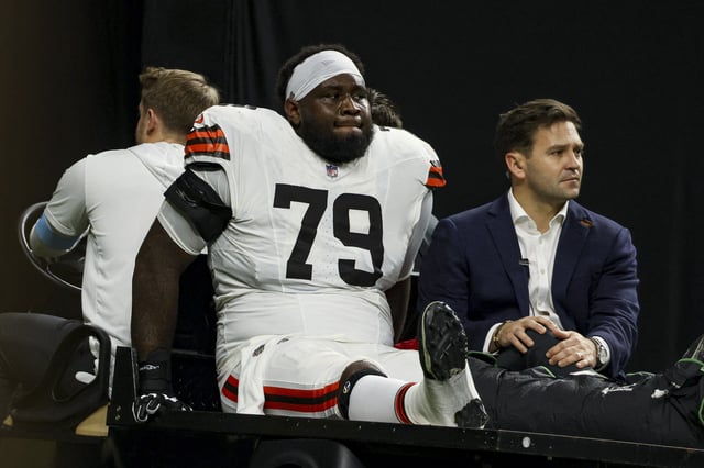 Dawand Jones #79 of the Cleveland Browns is carted off the field following an injury during the first half of a game against the New Orleans Saints at the Caesars Superdome on November 17, 2024 in New Orleans, Louisiana.