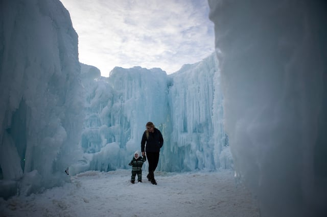 Visitors walk through the Ice Castle while visiting town during the Cripple Creek Ice Festival on Feb. 20, 2024, in Cripple Creek, Colo. (Photo by Timothy Hurst/The Denver Post)
