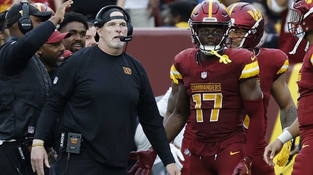 Sep 21, 2025; Landover, Maryland, USA; Washington Commanders head coach Dan Quinn (L) stands with Commanders wide receiver Terry McLaurin (17) on the sidelines against the Las Vegas Raiders during the third quarter at Northwest Stadium. Mandatory Credit: Geoff Burke-Imagn Images