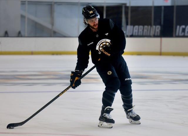 Allston, MA - David Pastrnak takes a shot during Bruins Captain's practice at Warrior Arena. (Nancy Lane/Boston Herald)
