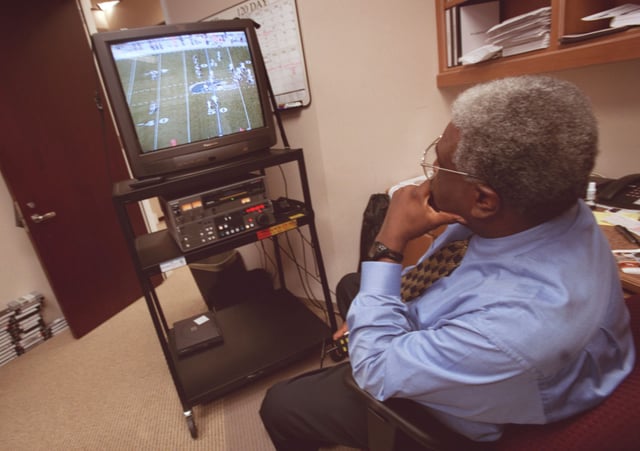 Bobby Grier, Associate Dir. of Pro Scouting studying tape at the offices for Houston's new NFL expansion franchise, Wednesday afternoon, July 12, 2000. For an upcoming Sports 2 on 'How to Build an NFL Team from the ground up'. (Smiley N. Pool/Chronicle) 07/12/00