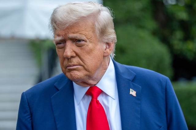 President Donald Trump talks to the media before boarding Marine One on the South Lawn of the White House on September 21.