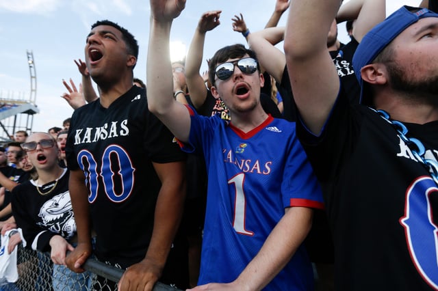 Kansas football fans yell out during a game against West Virginia at David Booth Kansas Memorial Stadium on Sept. 20, 2025.
