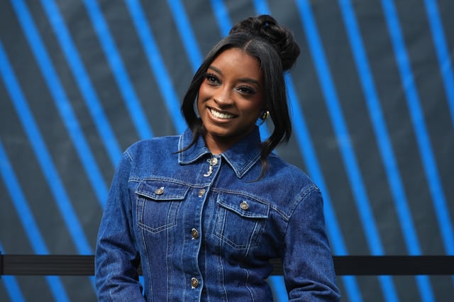 Simone Biles looks on before the game between the Dallas Cowboys and the Chicago Bears at Soldier Field on September 21, 2025 in Chicago, Illinois.