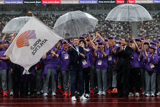 World Athletics Championships Tokyo 2025 - Japan National Stadium, Tokyo, Japan - September 21, 2025 World Athletics President Sebastian Coe waves a World Athletics flag during the Handover Ceremony REUTERS/Kim Kyung-Hoon