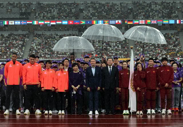 World Athletics Championships Tokyo 2025 - Japan National Stadium, Tokyo, Japan - September 21, 2025 Governor of Tokyo Yuriko Koike, World Athletics President Sebastian Coe, and Vice Mayor of Beijing Mu Peng are pictured during the Handover Ceremony