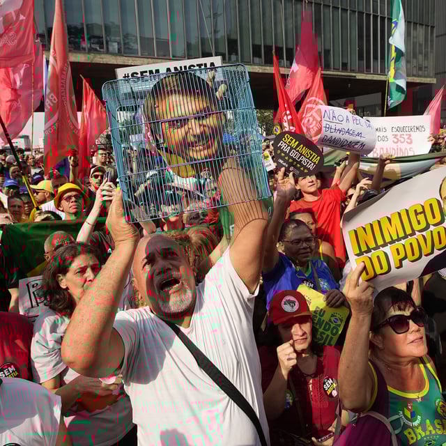 SAO PAULO, BRAZIL - SEPTEMBER 21: Thousands march along Avenida Paulista under the banner "Congress, Enemy of the People" to protest Congress and a proposed amnesty bill that could benefit former President Jair Bolsonaro on September 21, 2023 in Sao Paulo, Brazil on September 21, 2025. The protest came days after Brazil's Supreme Court sentenced Bolsonaro to 27 years in prison for allegedly plotting a coup following his 2022 election defeat. 