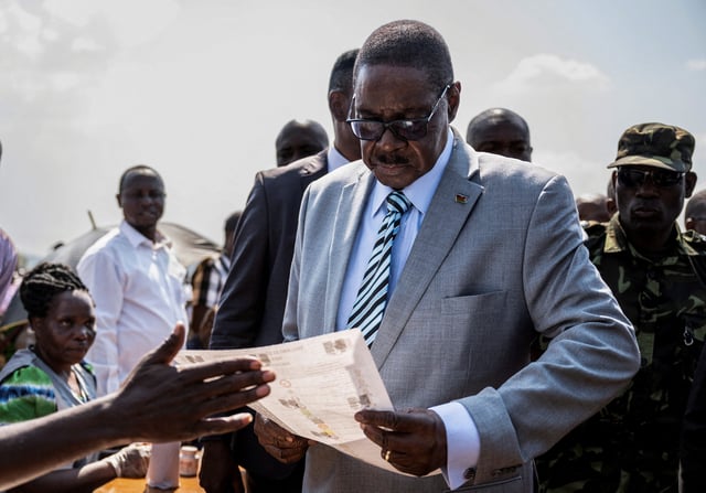 Malawi's presidential candidate and leader of the Democratic Progressive Party Peter Mutharika inspects a ballot paper before casting his vote during the general election at Thyolo District, south of Blantyre, Malawi, September 16, 2025. REUTERS/Stringer/File Photo